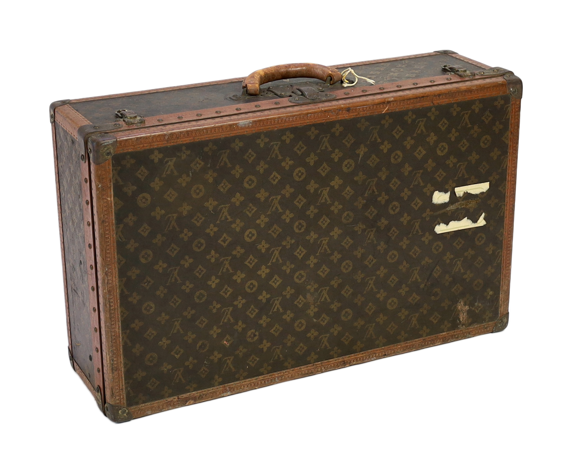 A vintage Louis Vuitton suitcase with monogram canvas and tan leather, width 71cm, height 44cm, depth 22cm